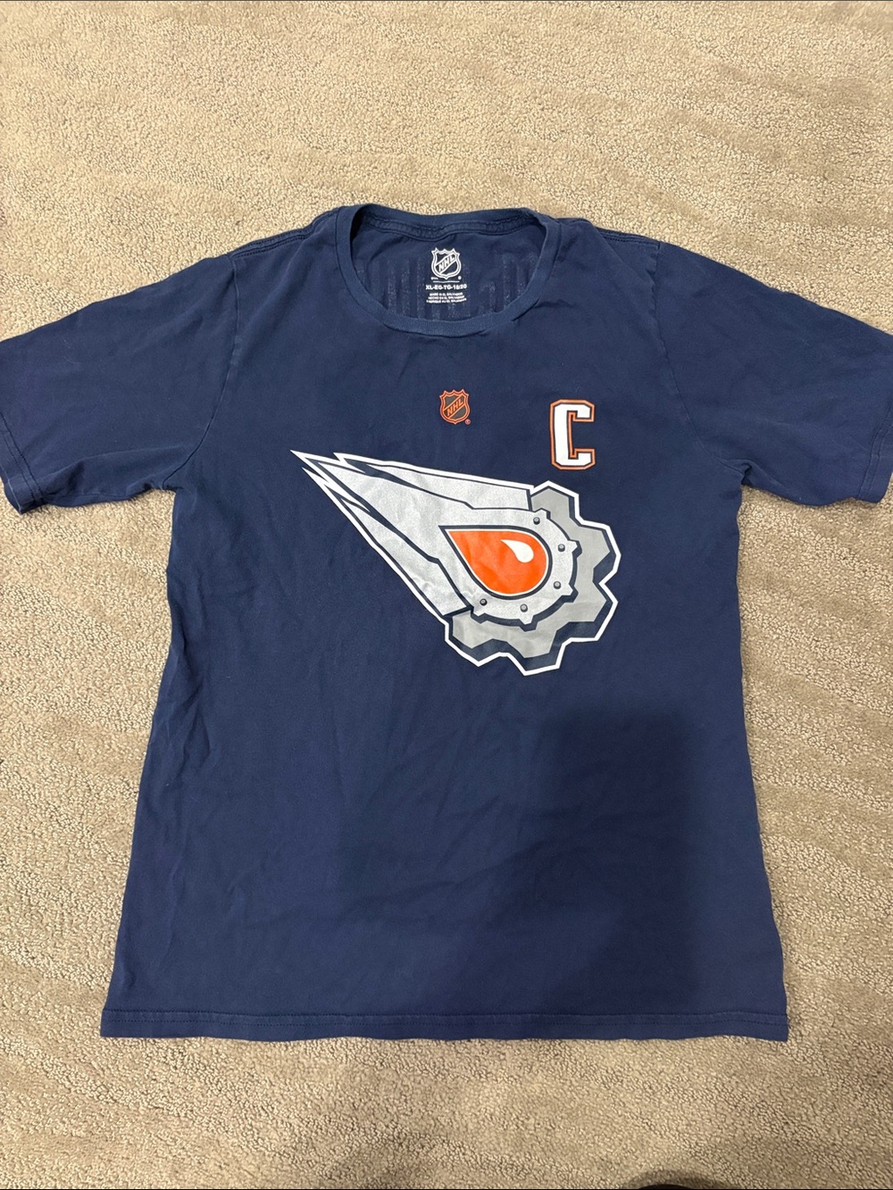 NHL Navy Short Sleeve Tee with Silver and Orange Crest kids size XL